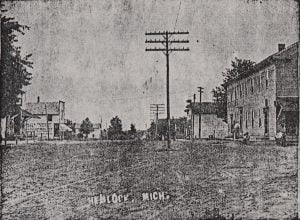 Hemlock City, a typical lumbering town in the early days, was settled in the early 1860s. This picture is representative of the appearance of Hemlock in the early 1900s.